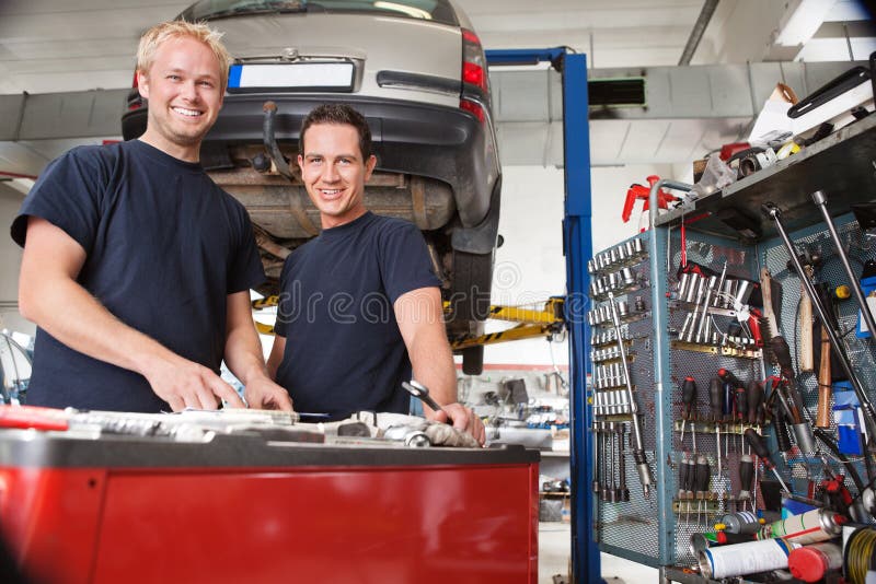 Mechanics at an auto shop stock image