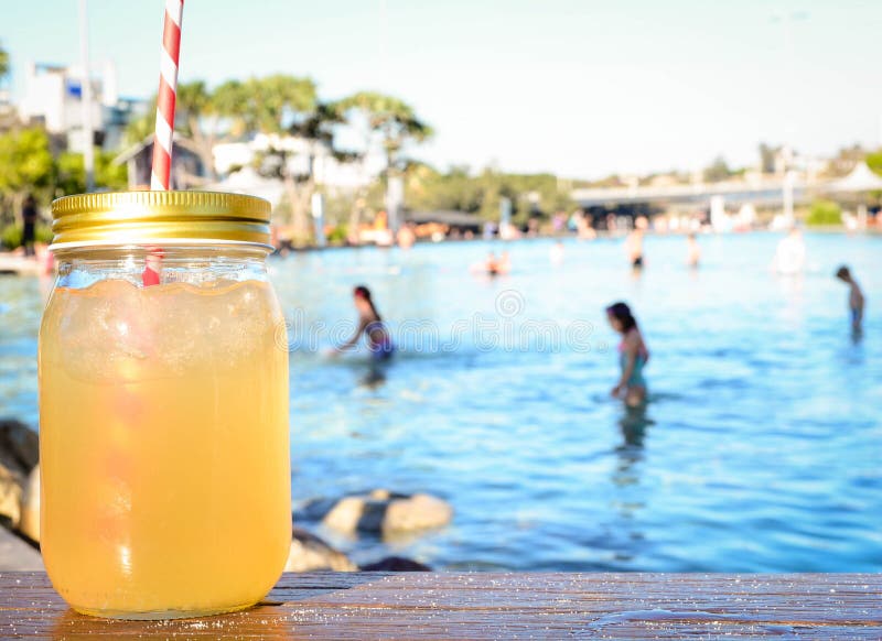 Enjoying Iced Mojito besides a pool on a hot summer day. Enjoying Iced Mojito besides a pool on a hot summer day