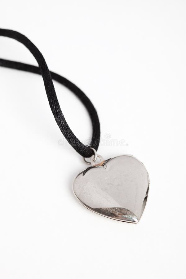 A isolated silver locket close up shot. A isolated silver locket close up shot