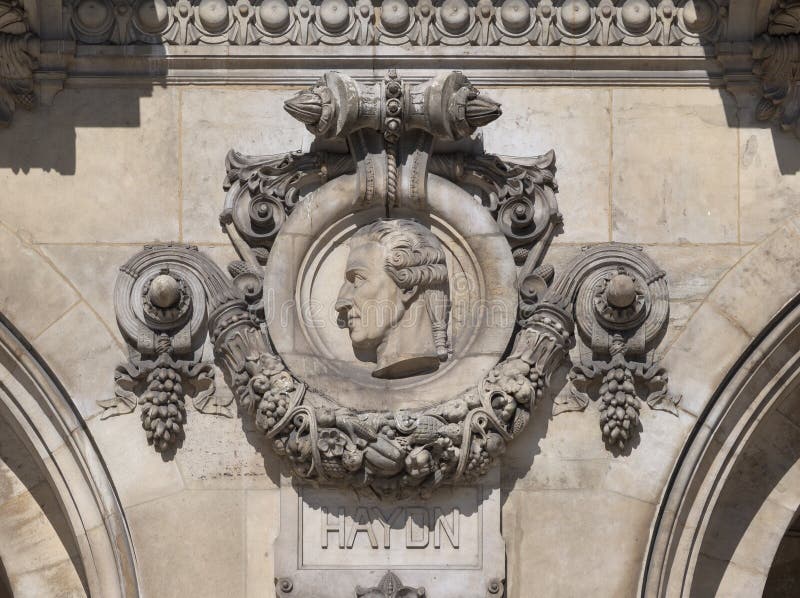Medallion with portrait of Joseph Haydn on facade Opera National de Paris stock images