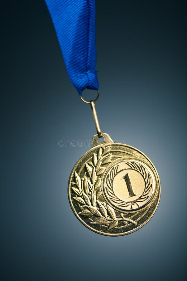 Artistic gold medal on blue background. Artistic gold medal on blue background