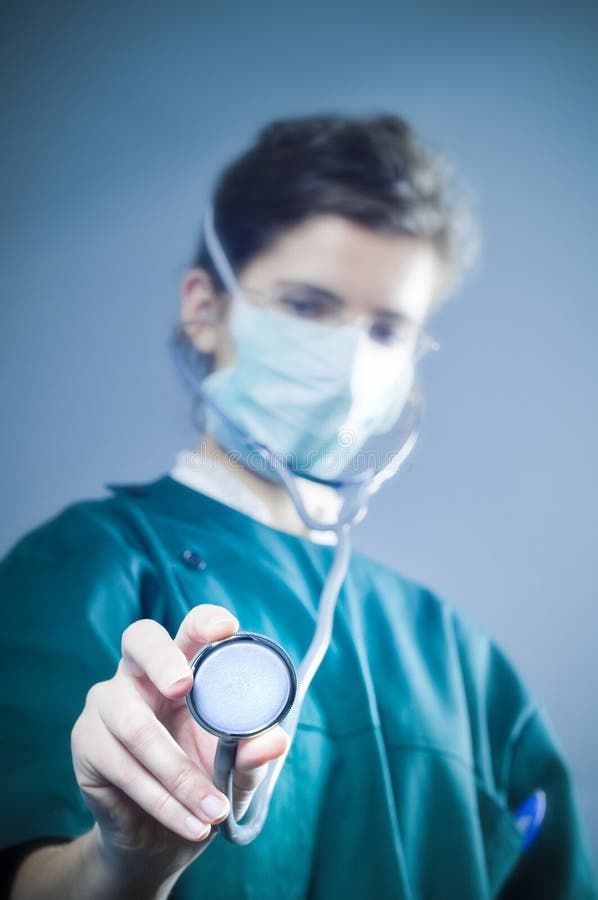 Medic with stethoscope. In an emergency room. Selective focus on stethoscope royalty free stock images