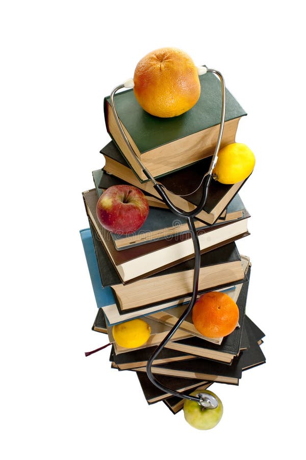 Medical books with fruits