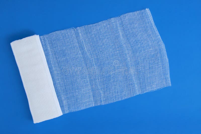 Medical Cotton Bandage on Blue Background. View from Above Stock Photo