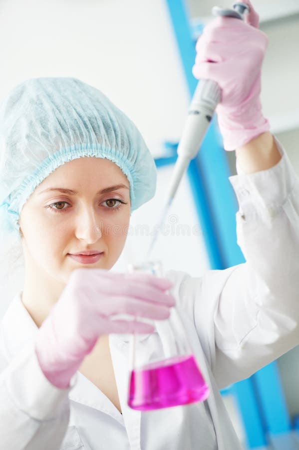 Medical doctor with flask dropper in a laboratory