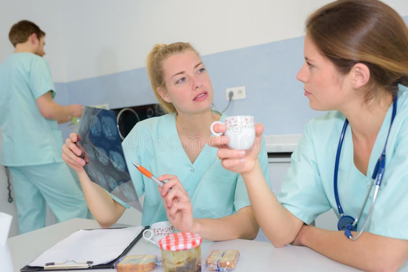 Medical doctor with nurses having coffee break royalty free stock image Medical doctor with nurses having coffee break royalty free stock image