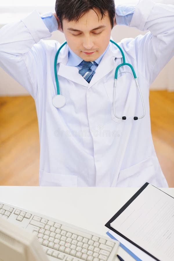 Medical doctor relaxing at office. top view royalty free stock photo