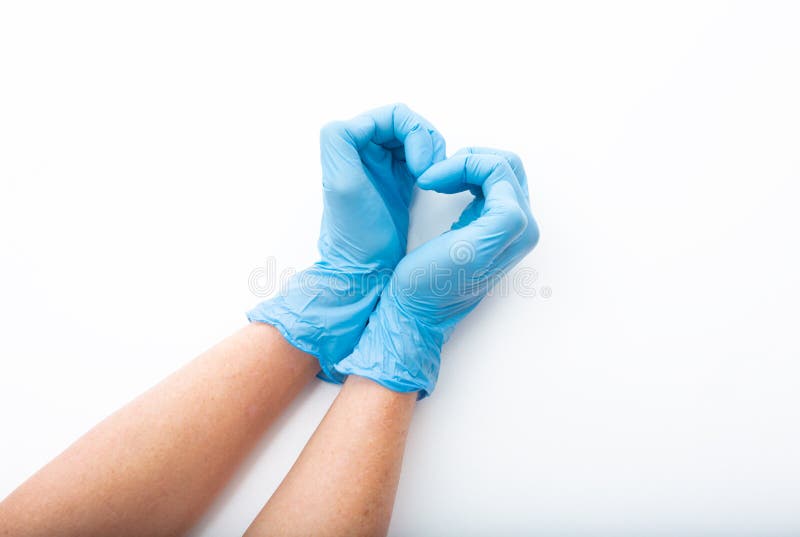 Medical gloved hands in the shape of a heart stock images Medical gloved hands in the shape of a heart stock images