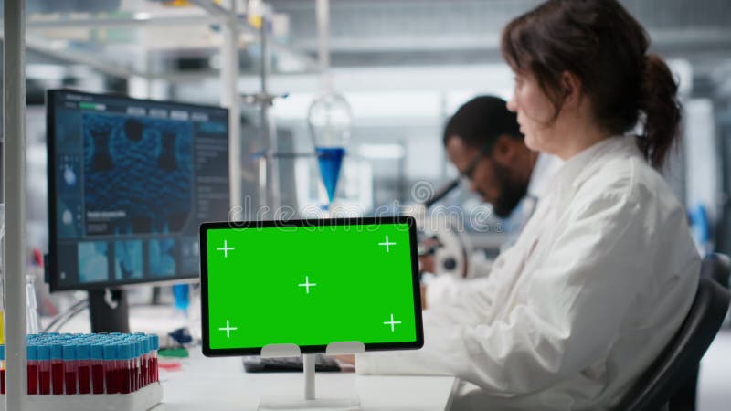 Medical laboratory technician using isolated screen tablet for DNA data analysis stock video footage