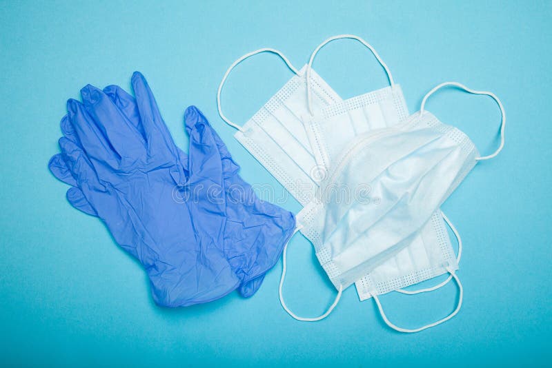 Medical mask and gloves. Blue background.