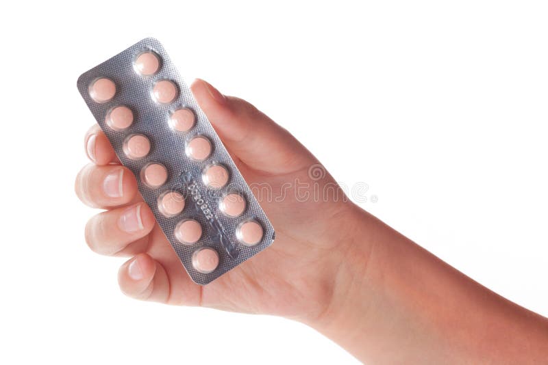 Medical pills container on a female hand, isolated