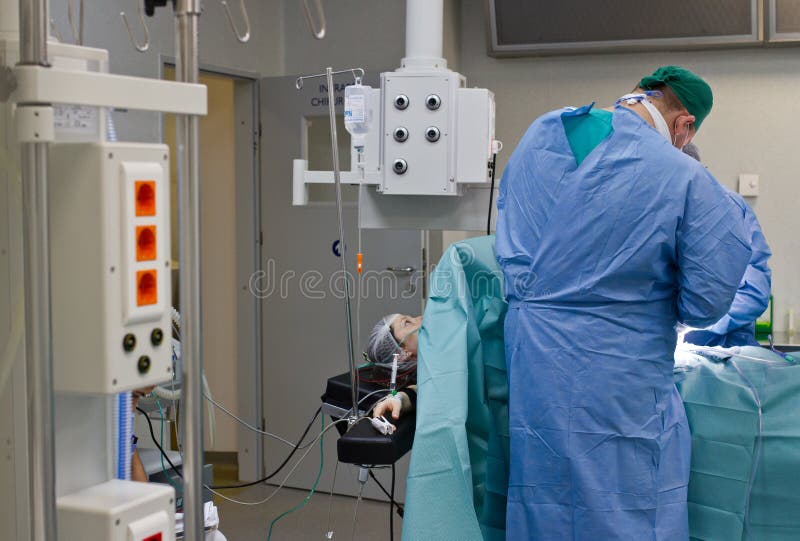 Patient woman during medical procedure in surgery room