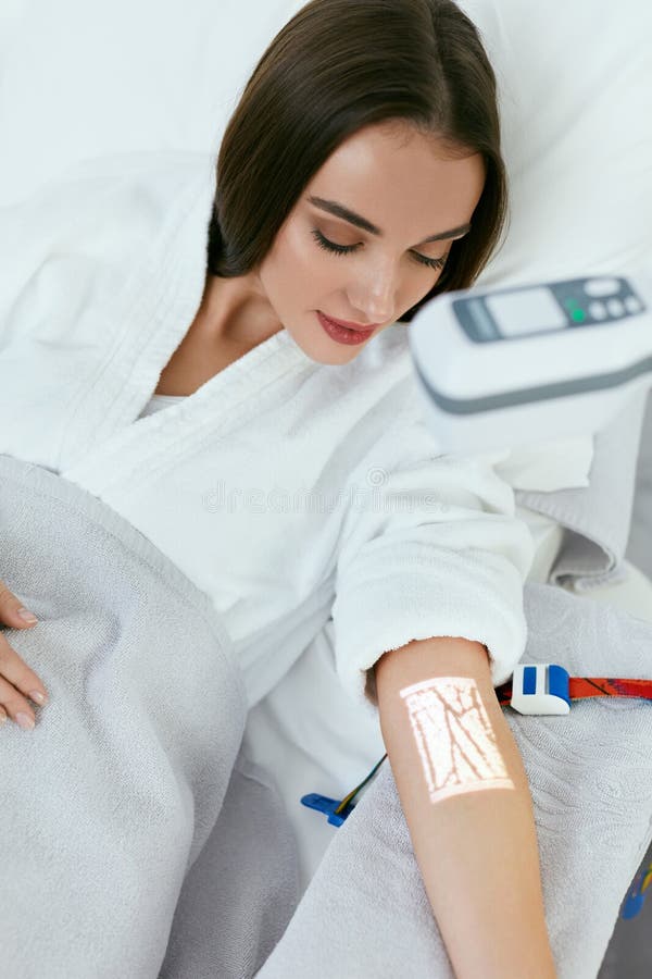 Medical Procedure. Woman Scanning Veins With Vein Finder, Vein Mapping On Hand. High Resolution