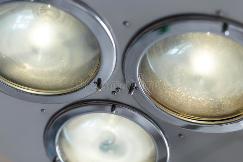 Medical professional metal bright lamp for operations. Bright light. Medical equipment. Close-up. stock image Medical professional metal bright lamp for operations. Bright light. Medical equipment. Close-up. stock image
