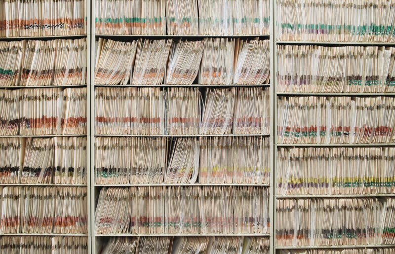 Medical Record Charts on Shelve Sorted Alphabetically Stock Photo