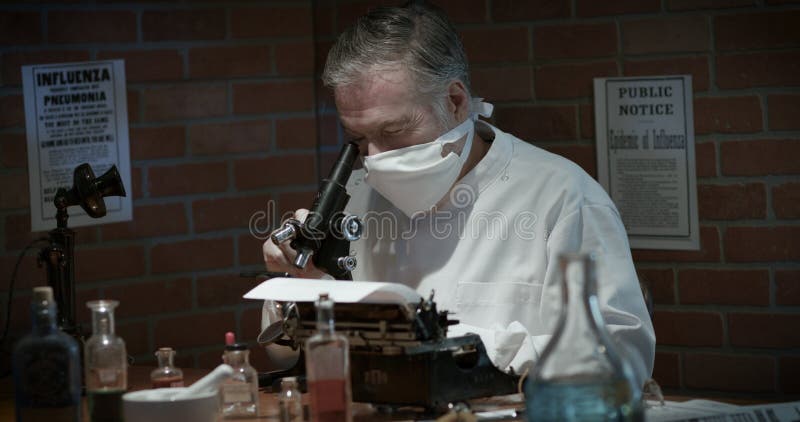 A medical scientist from 1918 in a small laboratory during the Spanish Flu influenza pandemic.