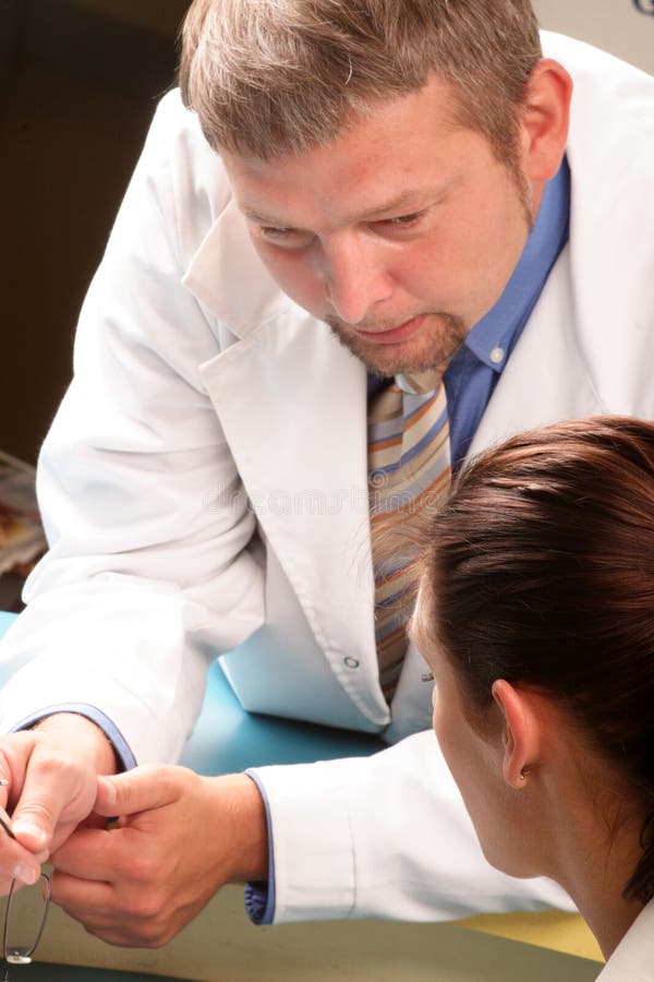 At The Doctor's Office - Doctor And Patient Stock Photo ...
