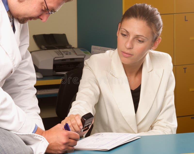 Medical secretary and doctor working together royalty free stock image Medical secretary and doctor working together royalty free stock image
