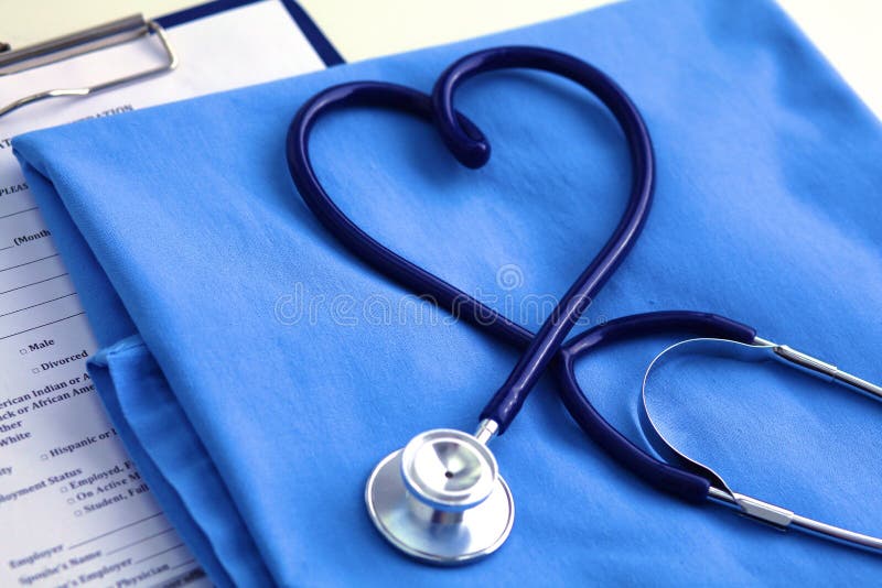 Medical Stethoscope Twisted In Heart Shape Lying On Patient Medical History  List And Blue Doctor Uniform Closeup Stock Photo, Picture and Royalty Free  Image. Image 80480566.