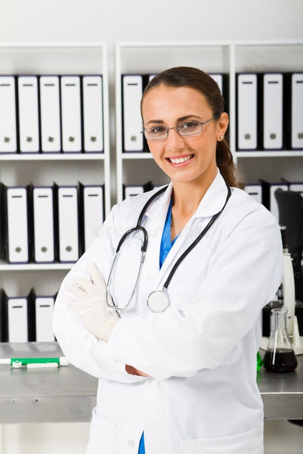 Young happy medical student in office. Standing file folder stock images, royalty-free photos and pictures