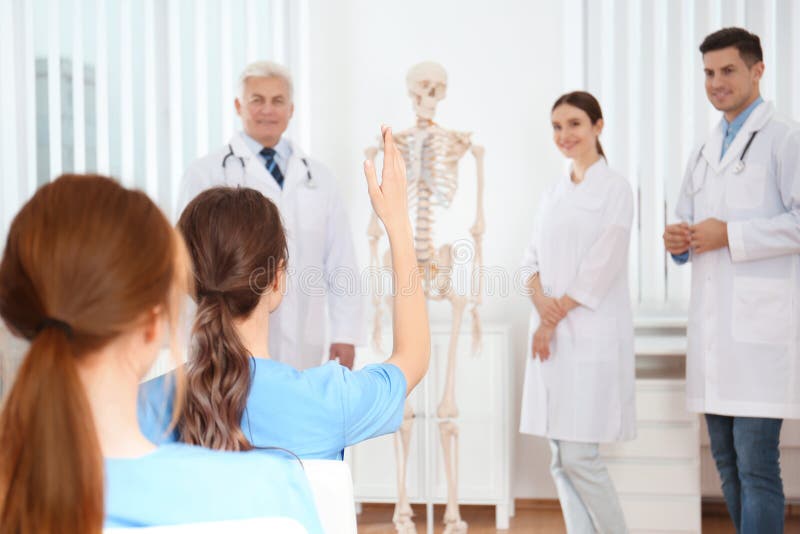 Medical students having lecture in orthopedics stock photography