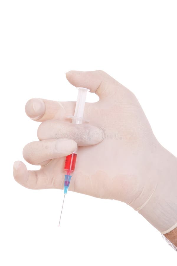 Medical syringe in hands