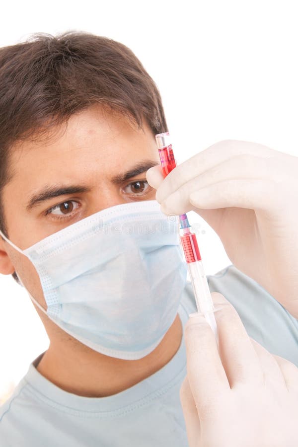 Medical syringe in hands