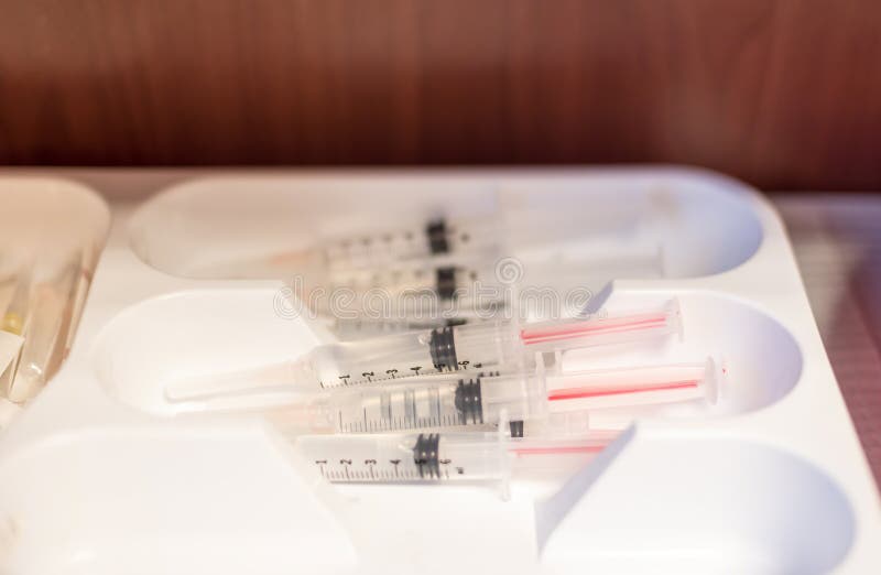 Medical syringes prefilled with saline solution