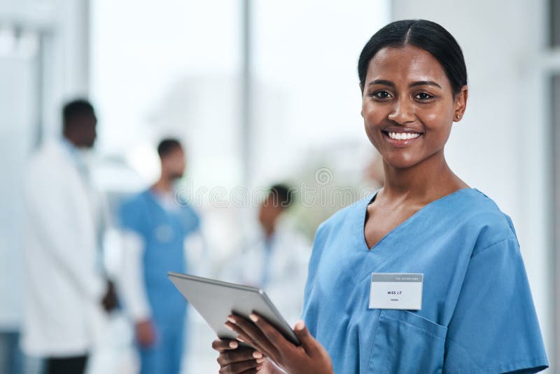 Medical, woman doctor and portrait with tablet in a clinic reading healthcare and wellness data at hospital. Employee