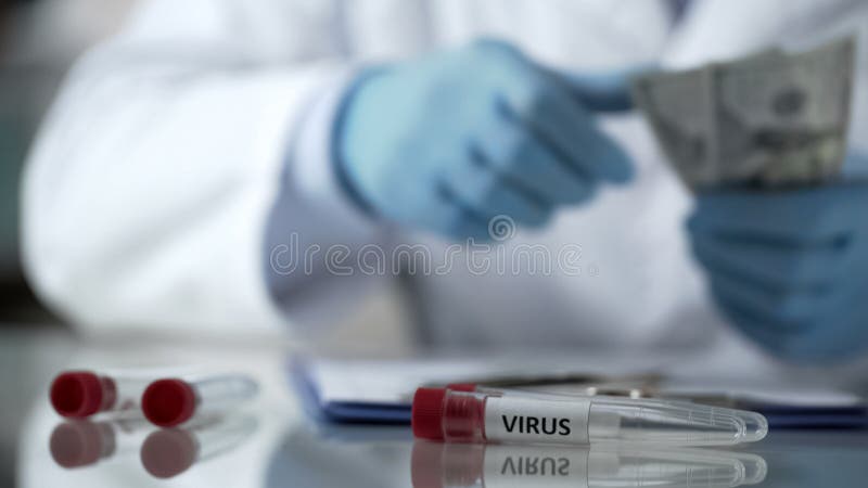 Medical worker counting dollar bills, reward for illegal virus development, stock photo