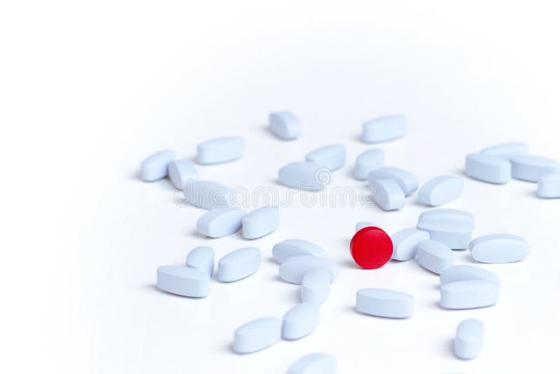 Medication, placebo concept. Red pill among light blue pills on white background.
