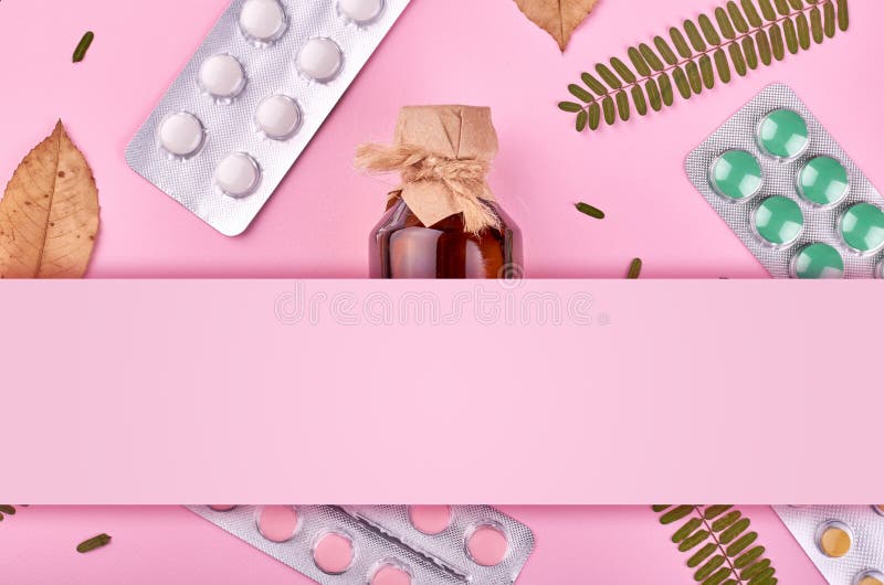 Medicine background - pharmacy. Pharmaceutical pills on pink backdrop. Flat lay image, copy space template