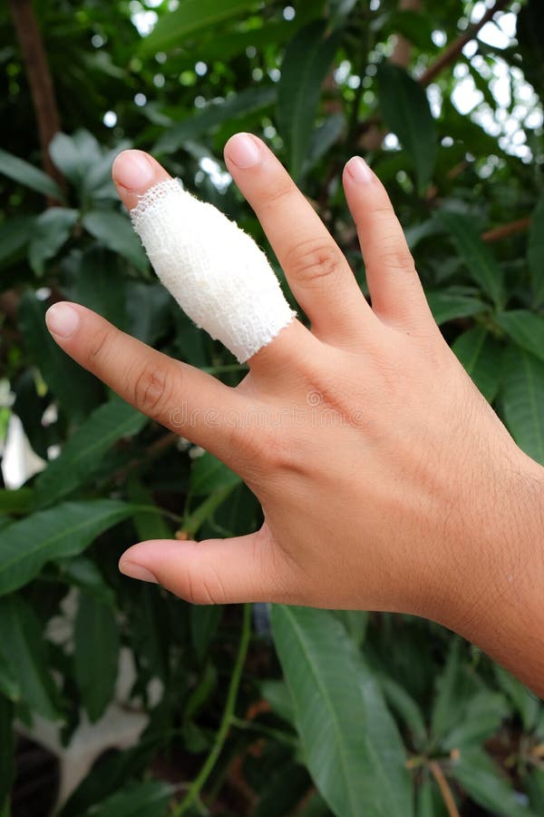 Medicine bandage on human injury hand finger