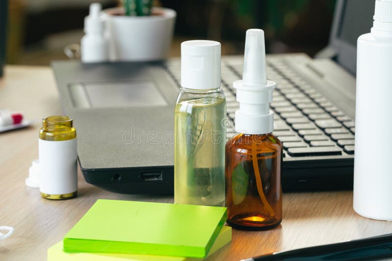 Medicine Bottle on an Office Table with Laptop Close Up Stock Image