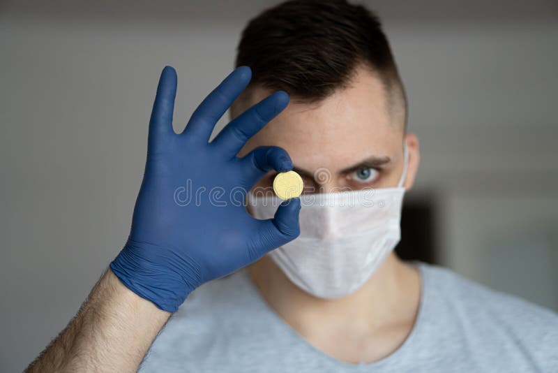 The medicine for coronavirus. The pill from the virus. Healthcare worker in the Coronavirus pandemic royalty free stock photo