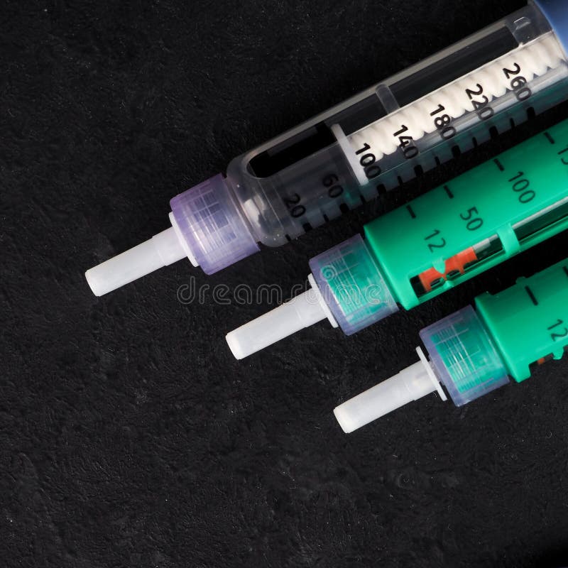 medicine, diabetes, advertisement and health care concept - close up of glucometer with blood sugar test stripe, insulin injection stock images medicine, diabetes, advertisement and health care concept - close up of glucometer with blood sugar test stripe, insulin injection stock images