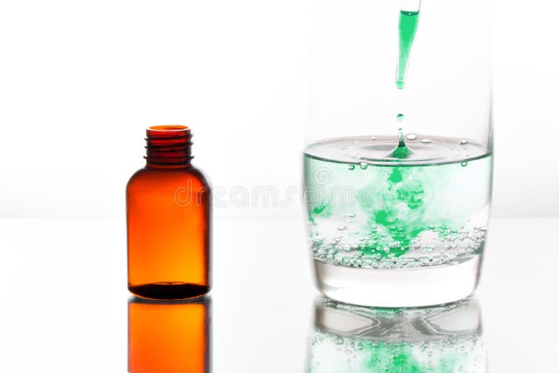 Medicine Dropping into a Glass of Water Stock Image Image of glass