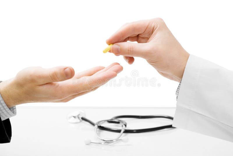 Doctor giving medicine to patient - isolated on white. Doctor giving medicine to patient - isolated on white