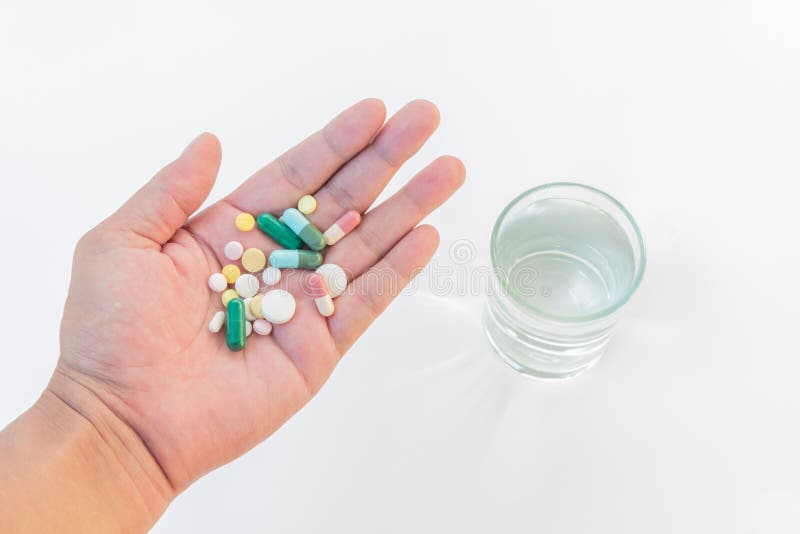 Medicines in hand stock image. Image of painkiller, capsule 28617971