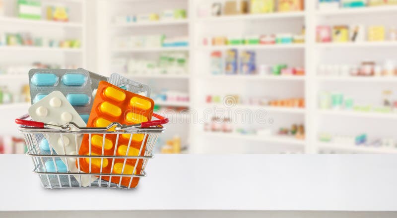 Medicine pills package in shopping basket with pharmacy drugstore shelves blur background. Medicine pills package in shopping basket with pharmacy drugstore shelves blur background
