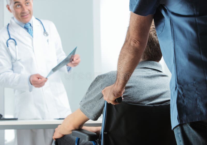 Male nurse pushing her patient on a wheelchair to meeting orthopedic doctor. Male nurse pushing her patient on a wheelchair to meeting orthopedic doctor