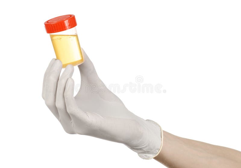 Medical theme: doctor's hand in white gloves holding a transparent container with the analysis of urine on a white background studio. Medical theme: doctor's hand in white gloves holding a transparent container with the analysis of urine on a white background studio