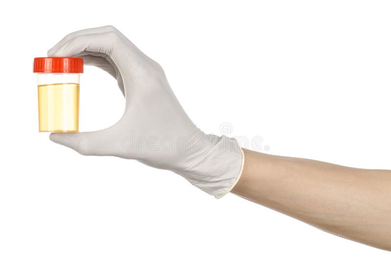 Medical theme: doctor's hand in white gloves holding a transparent container with the analysis of urine on a white background studio. Medical theme: doctor's hand in white gloves holding a transparent container with the analysis of urine on a white background studio