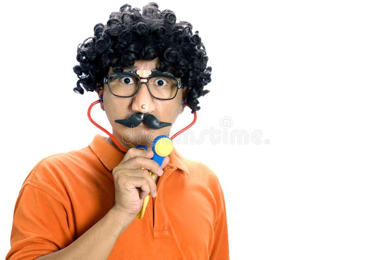 Portrait of an Asian man portraying as a comical doctor over white background. Portrait of an Asian man portraying as a comical doctor over white background.