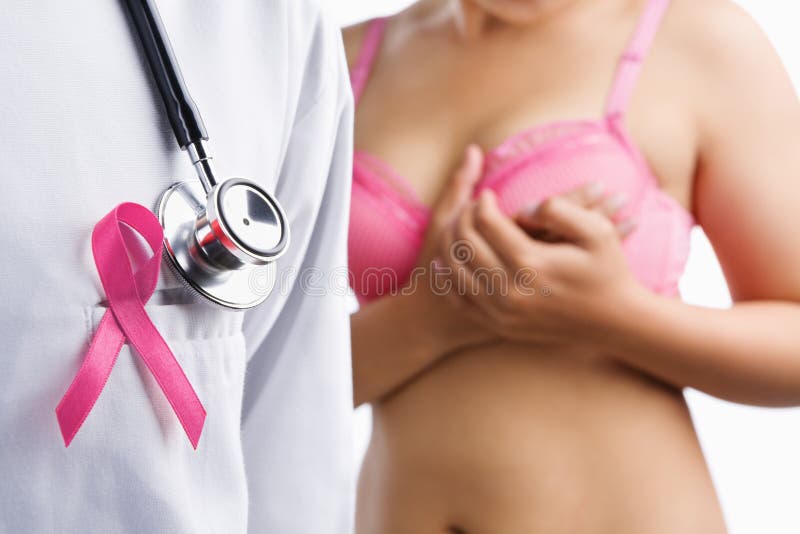 Doctor with pink badge and woman on pink bra on background, a concept for breast cancer. Doctor with pink badge and woman on pink bra on background, a concept for breast cancer