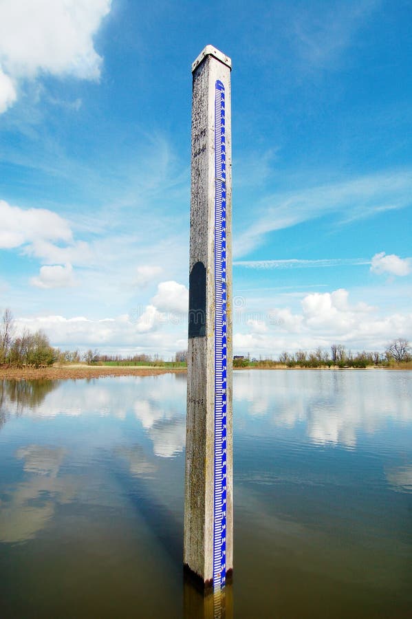 A water level measure ment on a blue sky background. A water level measure ment on a blue sky background.