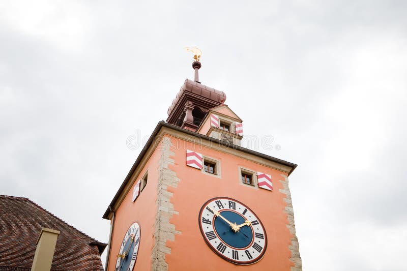 Medieval church steeple with big clock