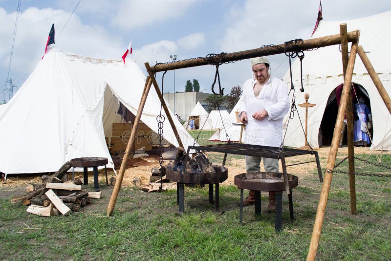 Medieval cook and the grill