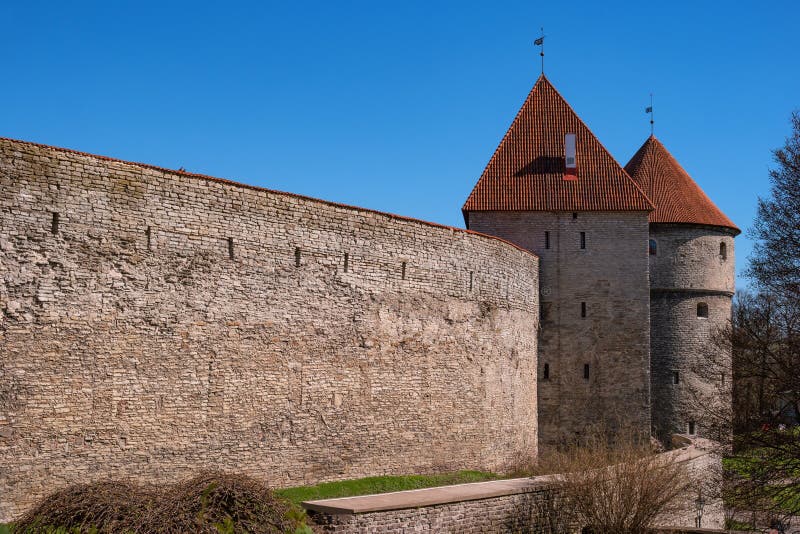 Medieval fortress with towers in the Old town. Tallinn, Estonia. The towers have a red tiled roof royalty free stock photo Medieval fortress with towers in the Old town. Tallinn, Estonia. The towers have a red tiled roof royalty free stock photo