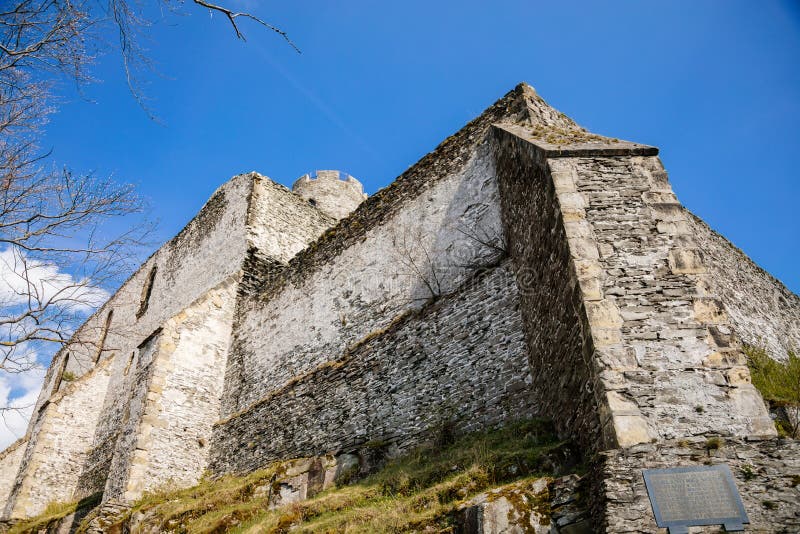 Medieval gothic castle Bezdez, grey stone ruin on hill at sunny day, ancient fortress walls, fairytale stronghold, high round